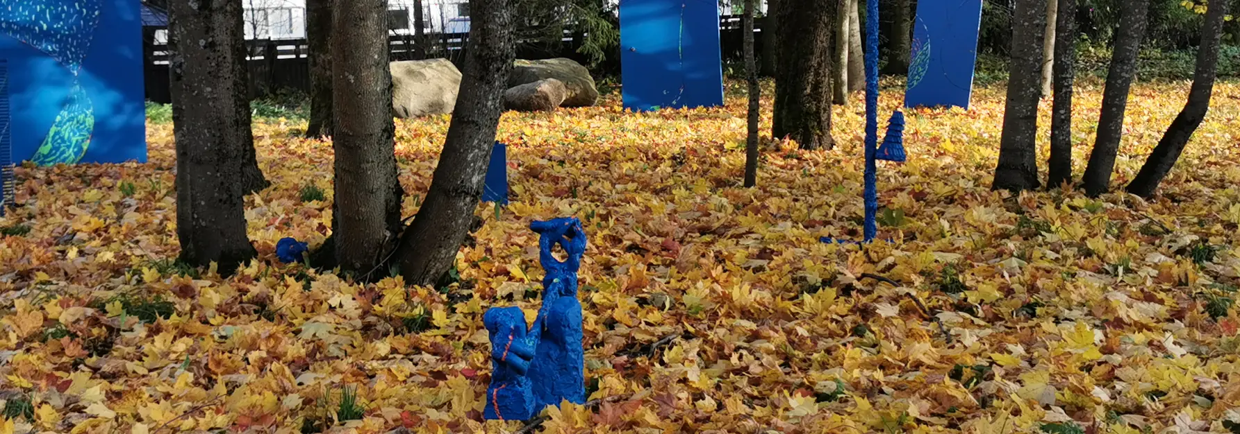 blue environmental artwork in orange autumn outdoors
